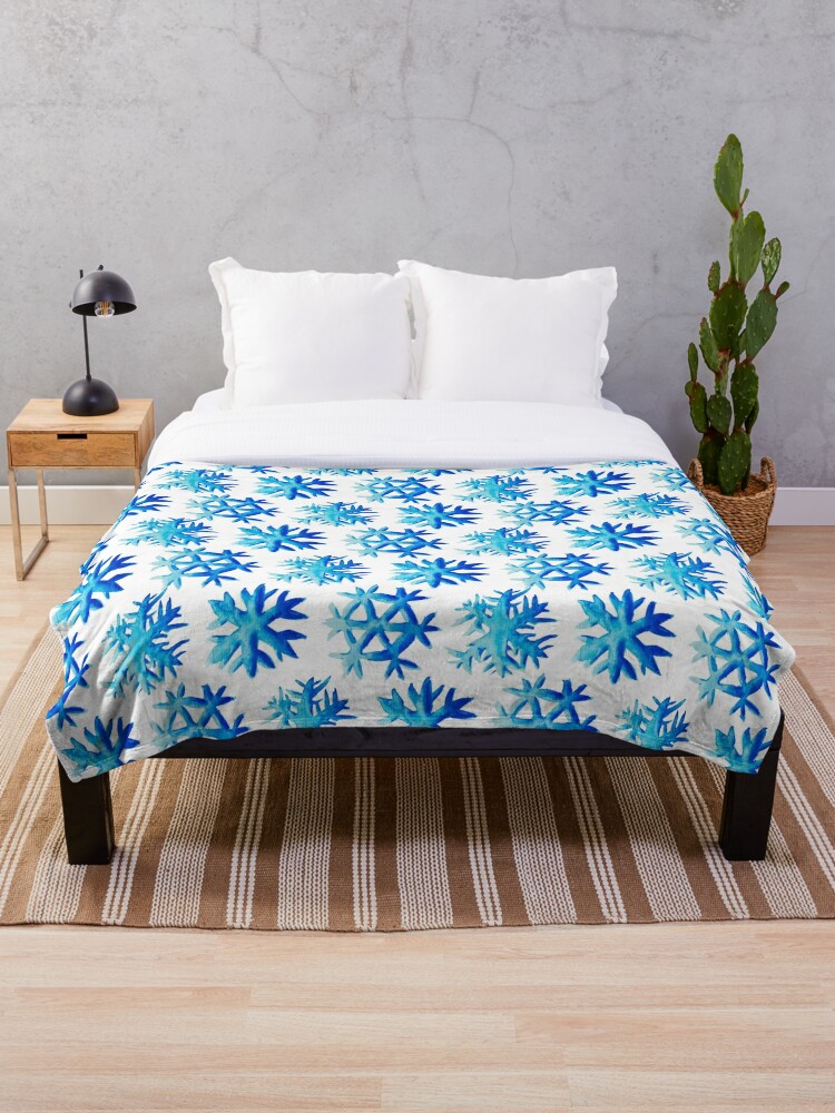 blanket with blue snowflakes pattern